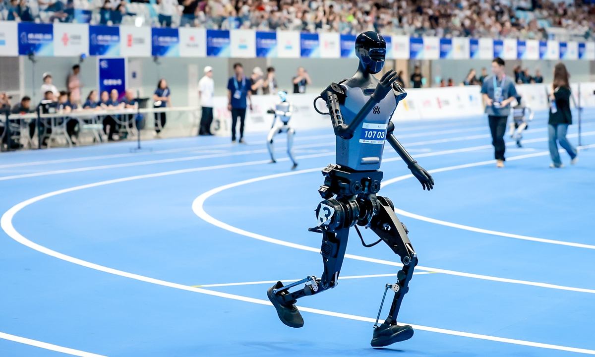 Humanoid robot competing on an indoor running track at the World Humanoid Robot Games in Beijing